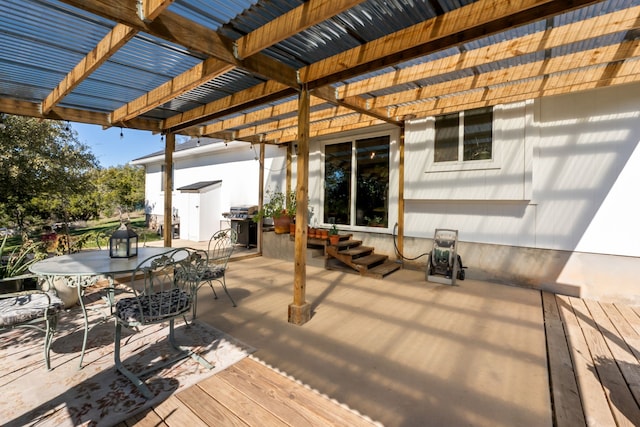 wooden deck featuring a pergola and grilling area