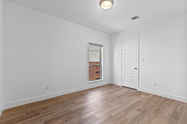 unfurnished room featuring light hardwood / wood-style flooring