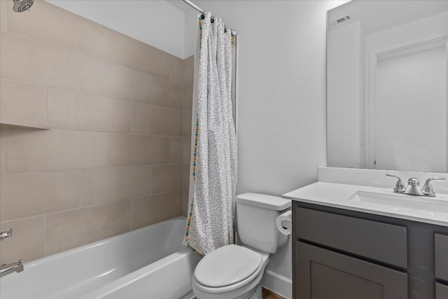 full bathroom with shower / bath combo with shower curtain, vanity, and toilet