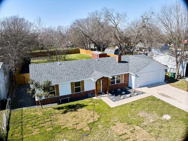 single story home featuring a garage, a shingled roof, fence, driveway, and a front yard