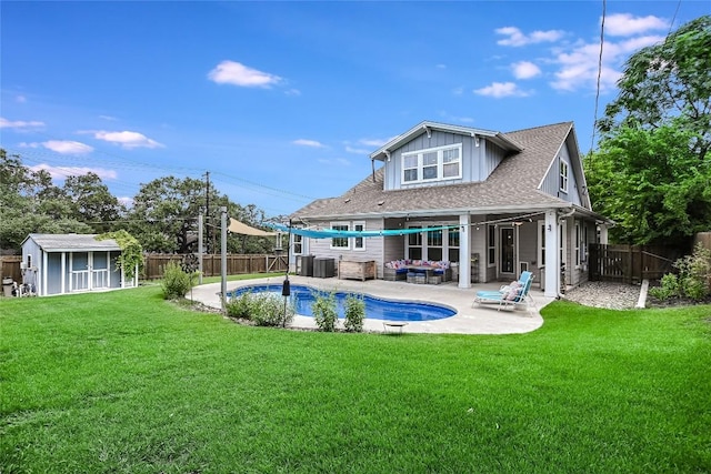 2717 Geraghty Ave, Austin, TX 78757 - back of property featuring a patio, roof with shingles, and board and batten siding