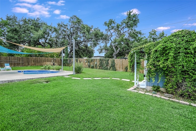 view of yard with a fenced in pool