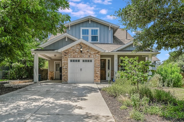 craftsman inspired home featuring covered porch, a garage, and a carport