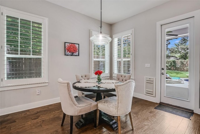 2717 Geraghty Ave, Austin, TX 78757 - dining room with dark wood finished floors and baseboards
