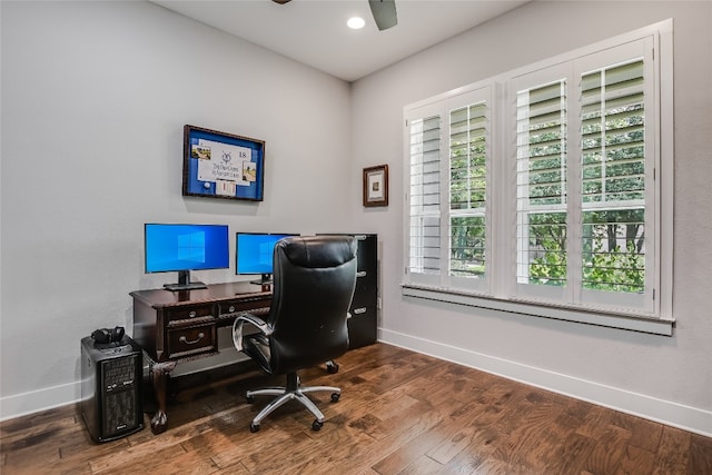 home office with hardwood / wood-style flooring and ceiling fan