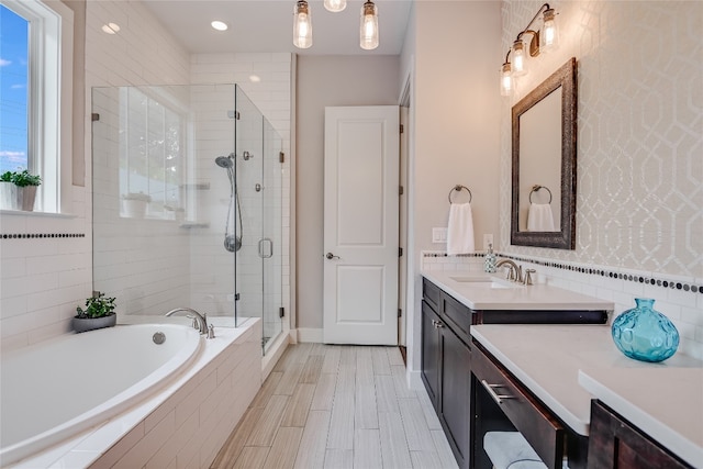 bathroom featuring vanity and plus walk in shower