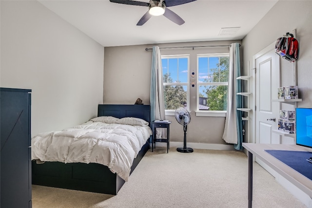 carpeted bedroom featuring ceiling fan