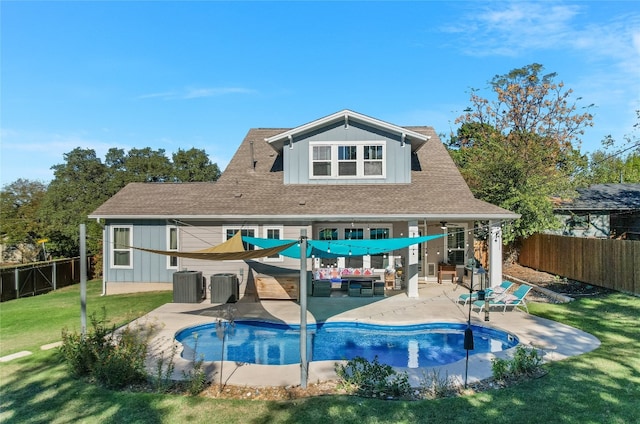 2717 Geraghty Ave, Austin, TX 78757 - back of house featuring an outdoor hangout area, board and batten siding, a patio, and cooling unit