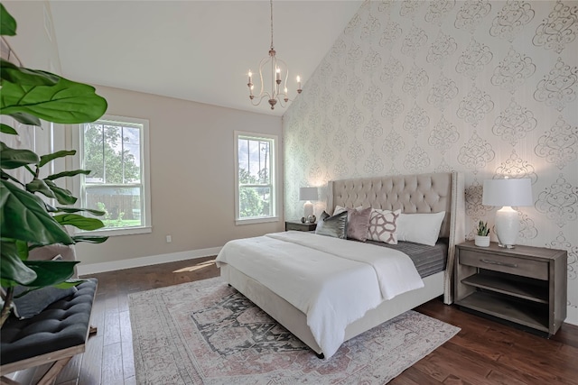 2717 Geraghty Ave, Austin, TX 78757 - bedroom featuring wallpapered walls, a chandelier, wood finished floors, and vaulted ceiling