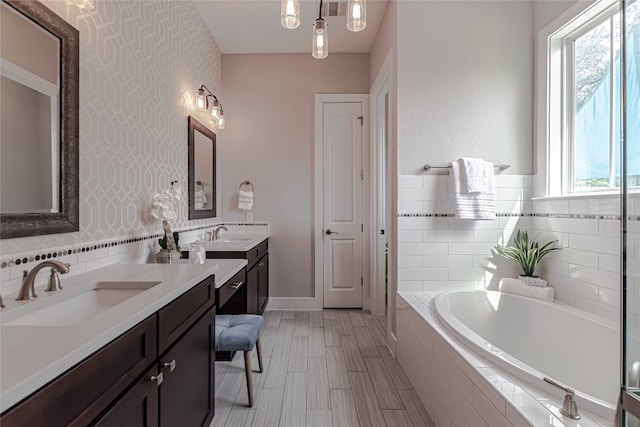 2717 Geraghty Ave, Austin, TX 78757 - bathroom featuring two vanities and a garden tub