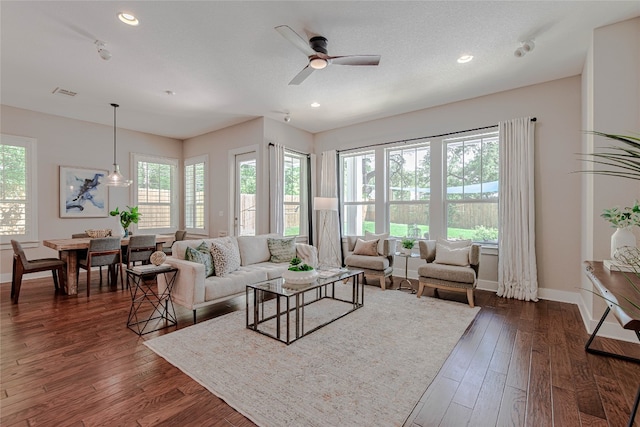 2717 Geraghty Ave, Austin, TX 78757 - living room with healthy amount of natural light, ceiling fan, dark wood-style flooring, and recessed lighting