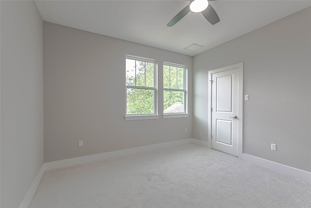 2717 Geraghty Ave, Austin, TX 78757 - spare room featuring a ceiling fan and light colored carpet