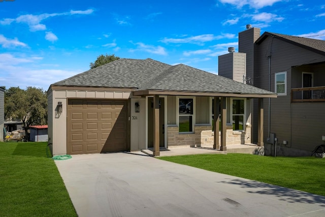 view of front of property with a garage and a front yard