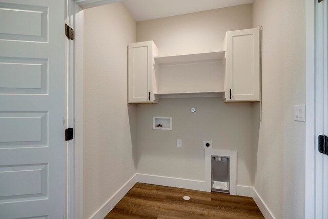 laundry area with cabinets, washer hookup, dark hardwood / wood-style floors, hookup for an electric dryer, and hookup for a gas dryer