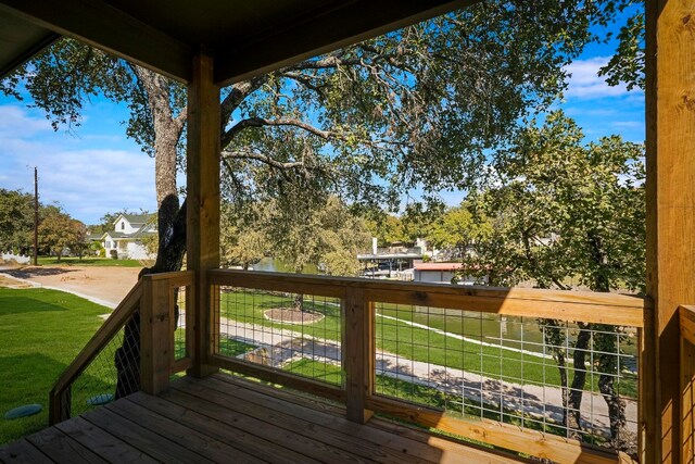 wooden deck with a yard