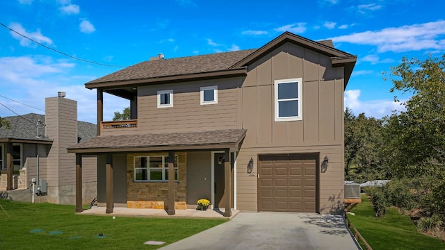 view of front of home with covered porch, a garage, cooling unit, and a front yard