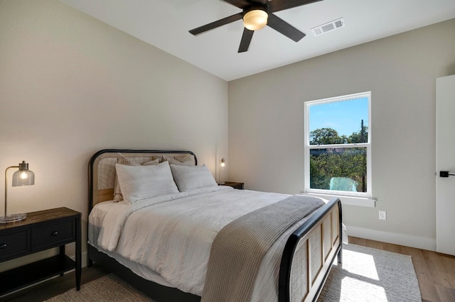 bedroom featuring ceiling fan and wood-type flooring