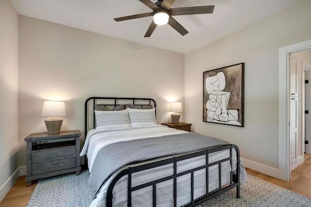 bedroom with light wood-type flooring and ceiling fan