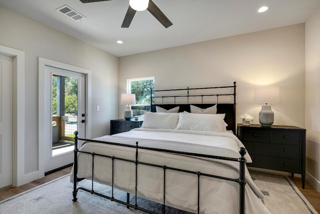 bedroom featuring light wood-type flooring, ceiling fan, and access to exterior