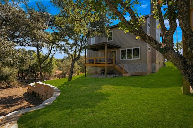 rear view of property featuring a yard