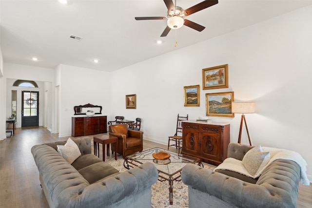 living room featuring light wood-type flooring and ceiling fan