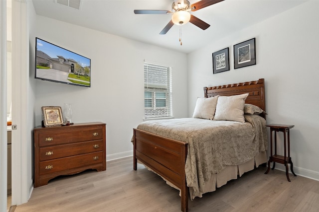 bedroom with ceiling fan and light wood-type flooring