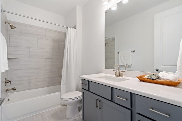 full bathroom with shower / tub combo with curtain, vanity, toilet, and tile patterned floors