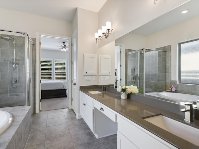 bathroom with ceiling fan, vanity, tile patterned floors, and shower with separate bathtub