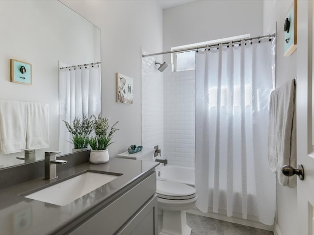 full bathroom with shower / tub combo with curtain, vanity, toilet, and tile patterned flooring