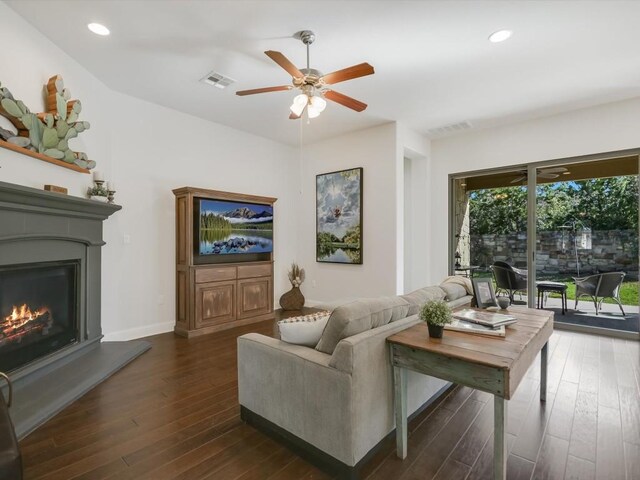 7405 Senger Pl, Austin, TX 78726 - living area with a ceiling fan, dark wood-type flooring, a glass covered fireplace, recessed lighting, and baseboards