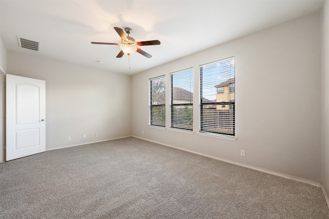 unfurnished room with ceiling fan and carpet floors