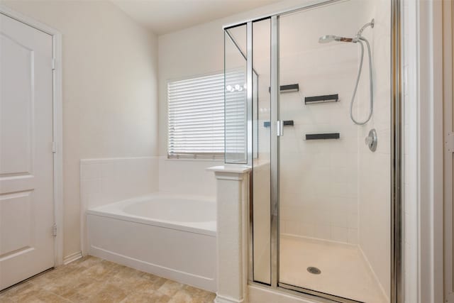 bathroom with separate shower and tub