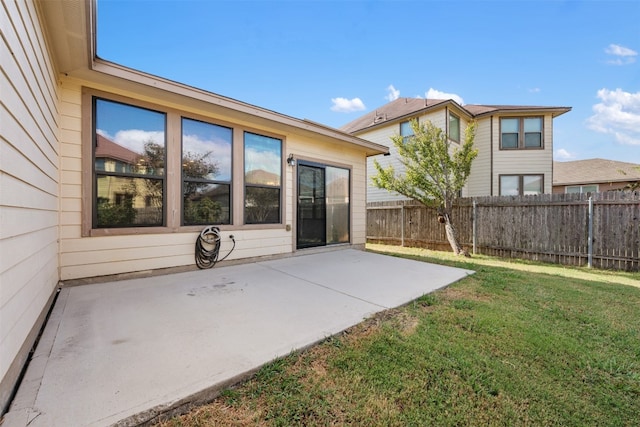 exterior space with a patio and a yard