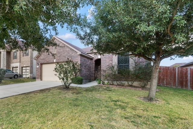 obstructed view of property featuring a garage and a front lawn