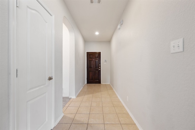 corridor with light tile patterned floors