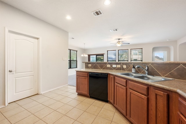 kitchen with dishwasher, decorative backsplash, a wealth of natural light, and hanging light fixtures