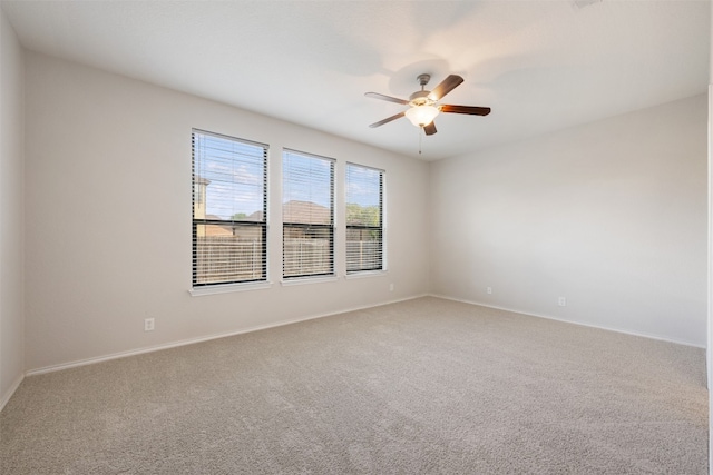 carpeted empty room with ceiling fan