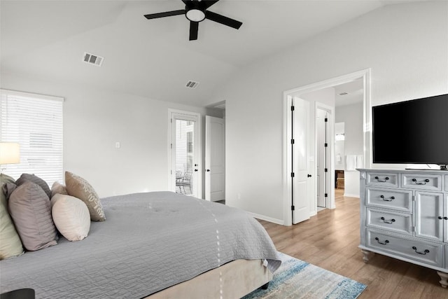 bedroom with ceiling fan, light hardwood / wood-style floors, and vaulted ceiling