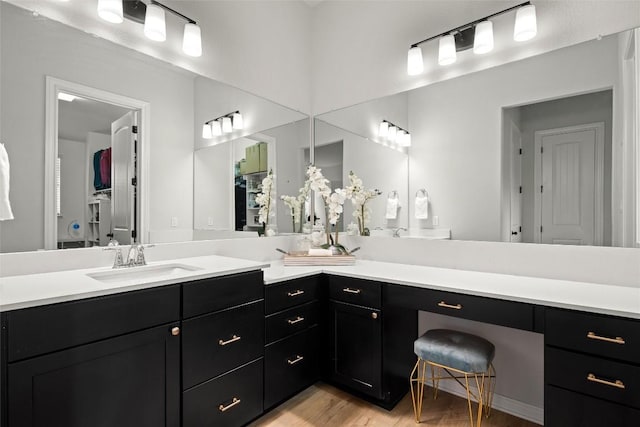 bathroom featuring hardwood / wood-style floors and vanity