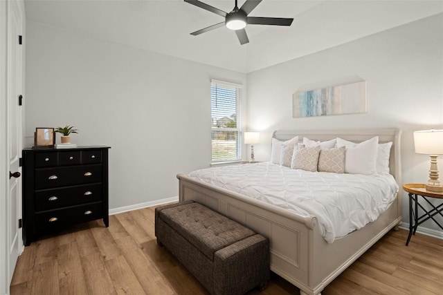 bedroom featuring light hardwood / wood-style floors and ceiling fan