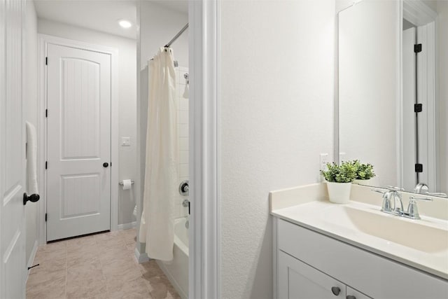 bathroom with shower / bath combination with curtain, vanity, and tile patterned floors