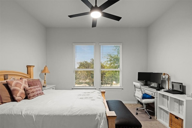 bedroom featuring light colored carpet and ceiling fan