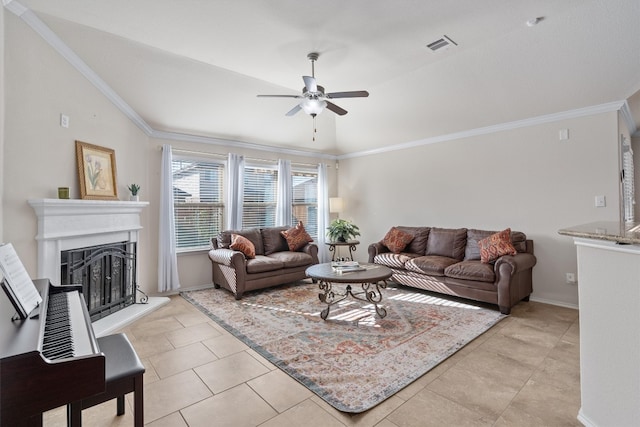 tiled living room featuring lofted ceiling, ornamental molding, and ceiling fan