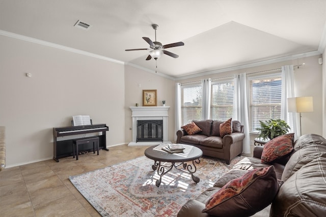 living room featuring ceiling fan, ornamental molding, vaulted ceiling, and light tile patterned flooring