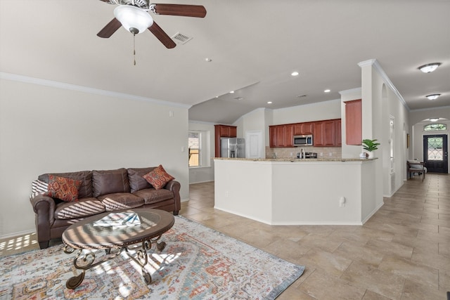 living room with french doors, ceiling fan, and crown molding