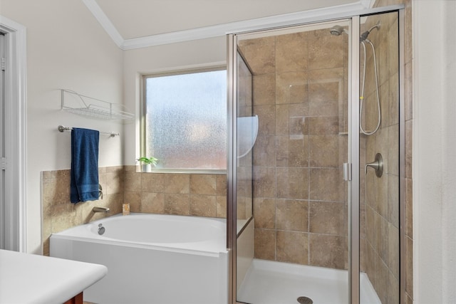 bathroom with ornamental molding, separate shower and tub, and lofted ceiling