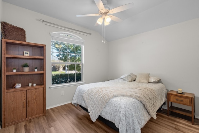 bedroom featuring hardwood / wood-style floors and ceiling fan