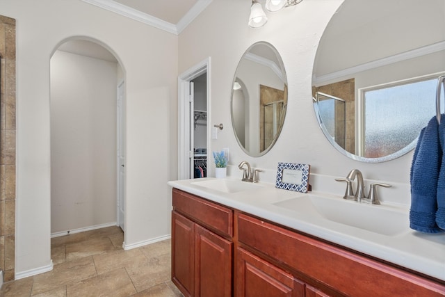 bathroom featuring a shower with door, vanity, and ornamental molding