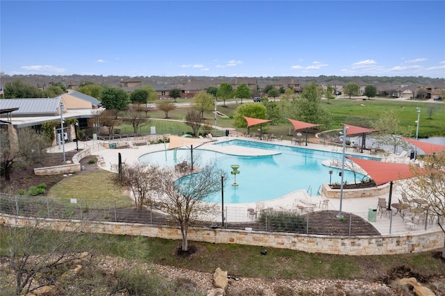 view of swimming pool with a patio