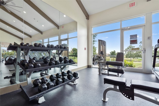 workout area with ceiling fan and vaulted ceiling